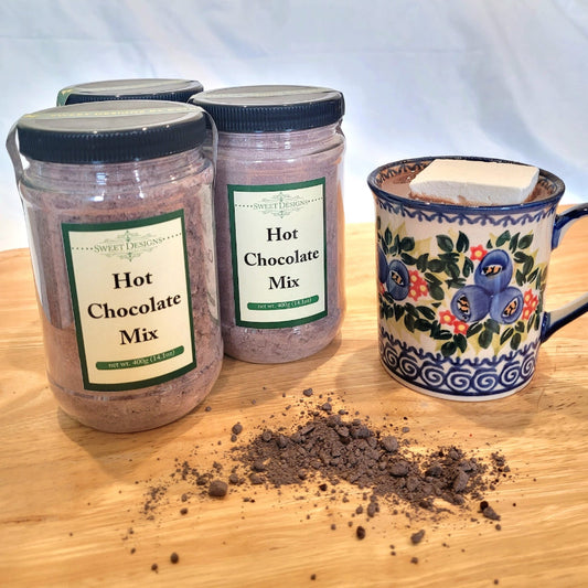 Hot chocolate in jars with a mug of hot chocolate with a marshmallow.