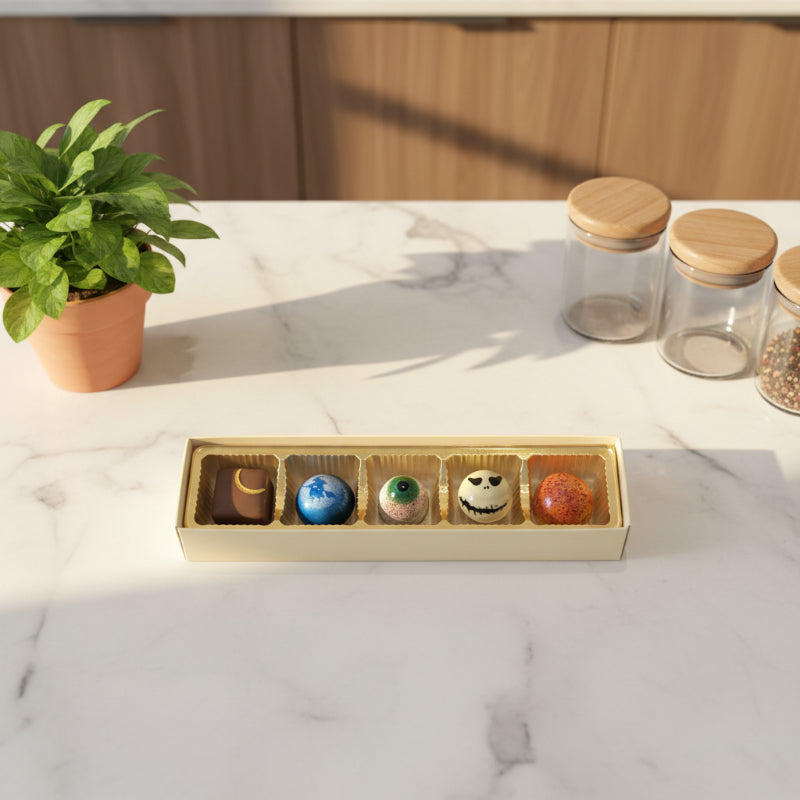 5-piece box of chocolate bonbons on a counter