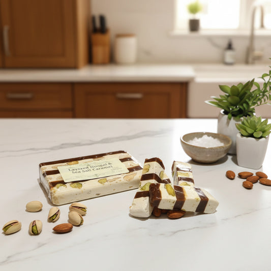 nougat candy with layers of sea salt caramel on a counter